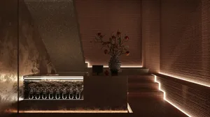 現代餐廳吧台，搭配混凝土牆面與照明階梯。