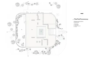 An architectural floor plan featuring a modern building with multiple rooms and outdoor areas.
