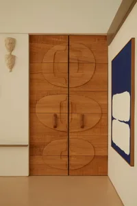 Modern design featuring wood paneling in an interior space.