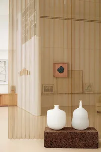 A modern interior design featuring glass elements and minimalistic aesthetic.