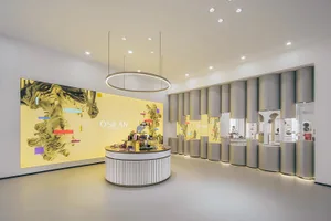Modern retail store with sleek glass and metal fixtures, illuminated by LED lighting.