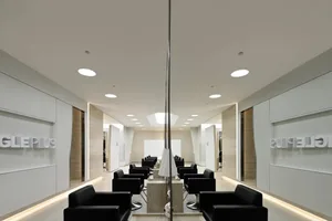 Modern hair salon with glass counter and sleek seating