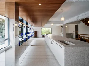 A modern kitchen interior featuring granite countertops and cabinets.
