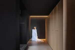 Minimalist interior with wooden and stone elements.