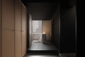 A minimalist bedroom featuring modern, light-colored wooden furniture and a simple, elegant design.