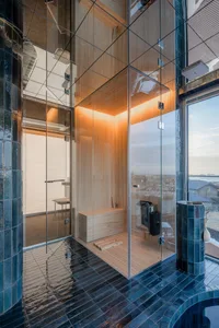 Modern bathroom with glass walls and wooden elements