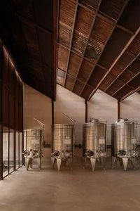 Industrially designed factory interior featuring metal storage tanks