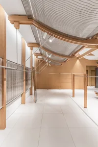 A minimalist retail storefront with wooden architectural elements and a modern design.