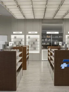 A modern pharmacy storefront with glass walls and interior design
