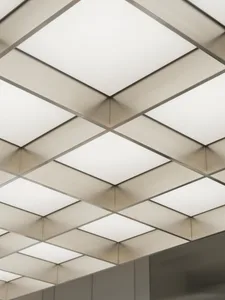 Metallic ceiling panels with integrated lighting fixtures for modern interior design.