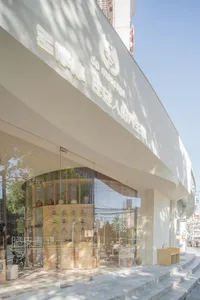 Modern storefront with large glass windows and minimalist design.