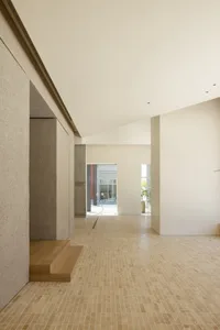 Modern architectural space with concrete walls and tile flooring.