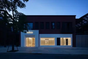 Modern storefront with glass windows and concrete base