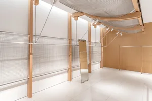A modern storefront with wood and metal elements.