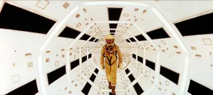 Astronaut floating in a metallic space tunnel