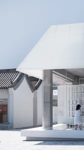 A minimalist retail storefront with a glass façade.