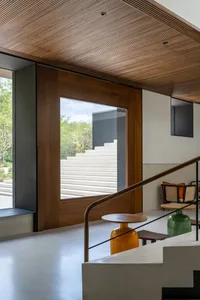 A modern minimalist interior design featuring natural wood elements.