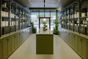 A modern retail storefront with concrete and marble finishes.