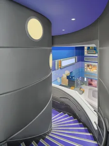 A futuristic, modern staircase with a metallic railing and purple steps.