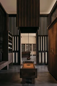 Industrial-style interior design featuring wooden elements and minimalist lighting.