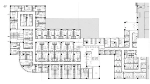 A detailed 2D architectural drawing depicting the layout of the 4th floor of a building, including multiple functional zones 