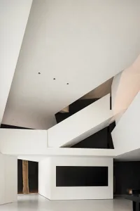 Modern interior design featuring minimalist concrete and wood elements.