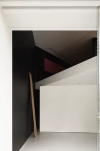 Modern minimalist interior design with white walls and open space.