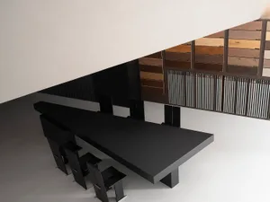 A modern office space with a sleek, minimalist design featuring metal elements.
