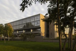 Modern office building with large glass windows and concrete walls