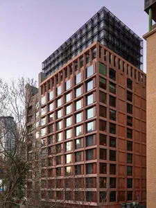 Modern building with concrete and glass exterior.