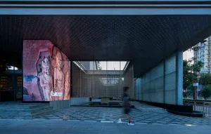 Modern entrance featuring concrete and glass materials.