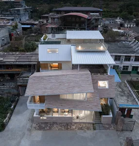 A modern minimalist villa with wood, glass, and metal materials.