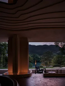Modern spa interior with concrete walls and warm lighting
