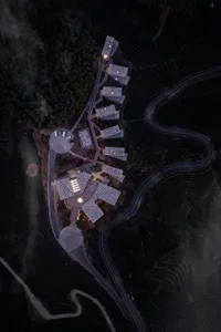 Aerial view of a modern residential building with concrete materials.