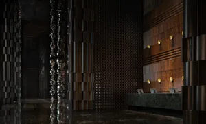 A sleek, modern lobby featuring metallic columns and wooden accents.