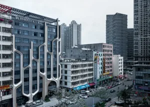 A modern urban streetscape featuring a variety of buildings with unique architectural designs and a bustling street filled wi