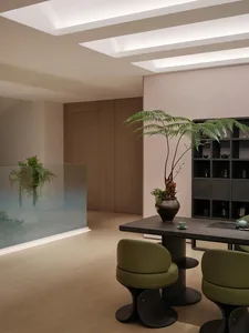 A modern interior space featuring wooden furniture and glass elements