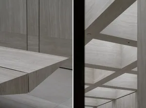 Modern minimalist interior with wooden panels and beams, showing clean lines and an open space.