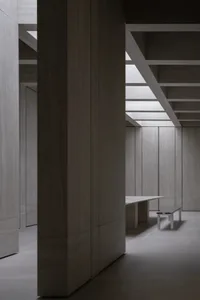 Modern office space featuring wooden panels on walls and ceiling.