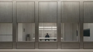 A modern office space featuring glass walls.