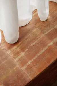 Modern interior design featuring a close-up of a terracotta floor tile.