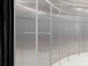 Modern interior design featuring a glass storefront display case with a sleek, minimalist aesthetic.