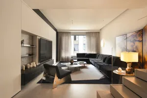 Contemporary living room featuring metallic furniture and minimalist design.