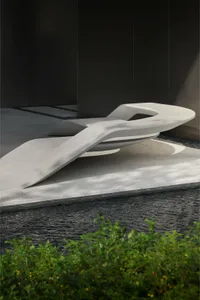 Modern bench with abstract, sculptural design in concrete material