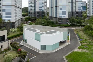 A modern building with a concrete and glass exterior.