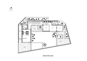 Architectural floor plan of a modern house with bedrooms, bathrooms, and an open living area.