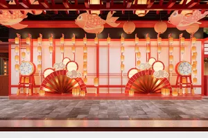 A festive setup with paper fish and lanterns for an event decoration.