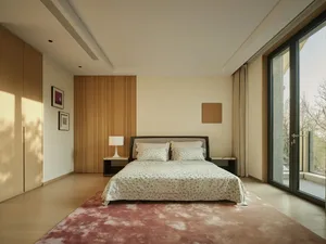 A modern bedroom featuring a carpeted floor, wooden headboard, and glass sliding doors.