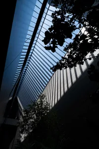 A modern interior space featuring metallic blinds