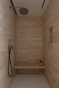 現代簡約淋浴間，採用中性色調瓷磚牆面與地面，搭配內建座椅與不鏽鋼配件